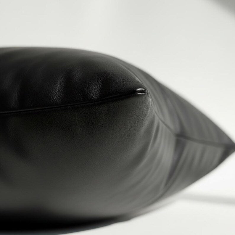 Black vegan leather pillow cover showing concealed hidden zipper closure detail