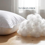 Close-up of a white down alternative pillow insert beside a pile of fluffy 7D virgin fiber filling. Showing synthetic...
