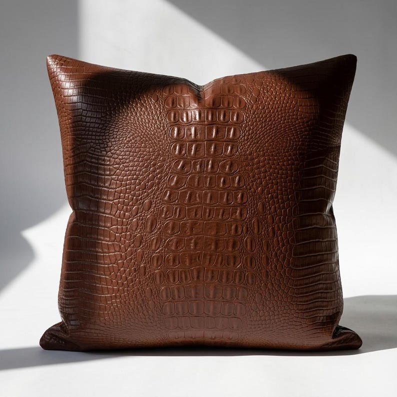 Single brown vegan leather crocodile embossed pillow cover – front view