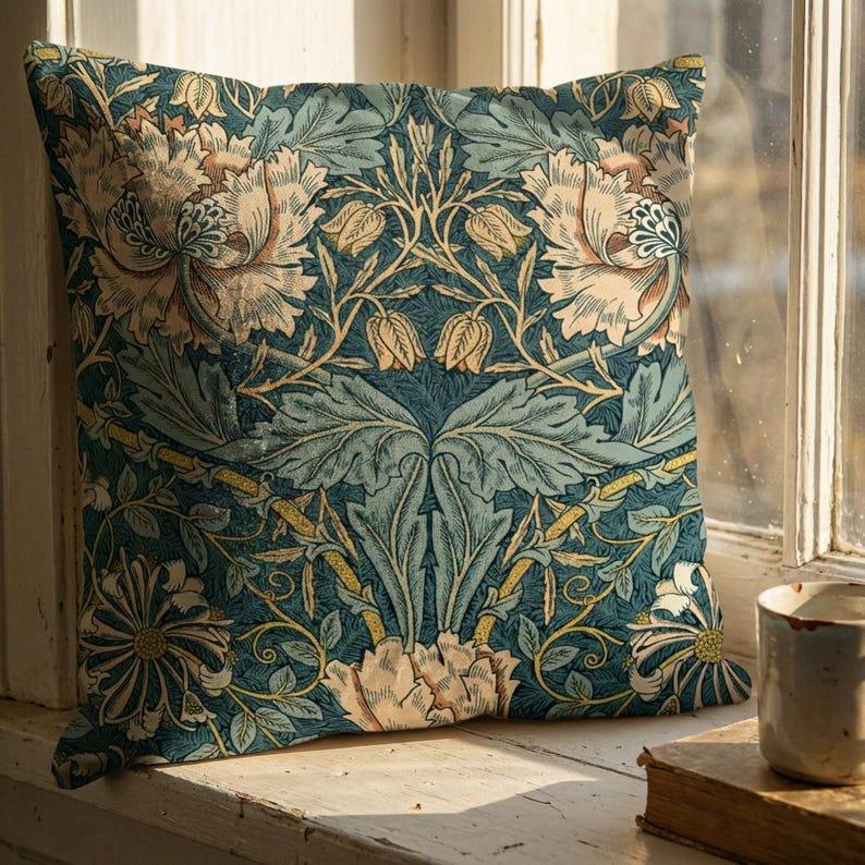 William Morris floral velvet pillow cover in teal displayed on windowsill with warm natural light