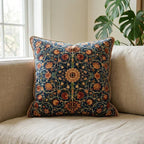 William Morris velvet throw pillow cover styled on a linen sofa with botanical medallion print in navy, coral, and gold