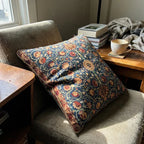 William Morris floral velvet pillow cover on a reading chair in cozy home setting, navy blue Arts and Crafts botanical design