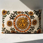 Embroidered celestial sun lumbar pillow cover with sunflower and zodiac motifs on off-white cotton canvas