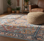 Boho medallion multicolor area rug styled in a bohemian living room with leather chair and woven pouf