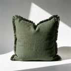 Single olive green linen fringe pillow cover showing full fringe edge detail and relaxed woven texture