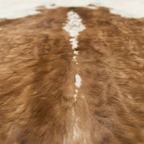 Macro texture detail of brown and white vegan leather cowhide print rug – Larissa Home Decor