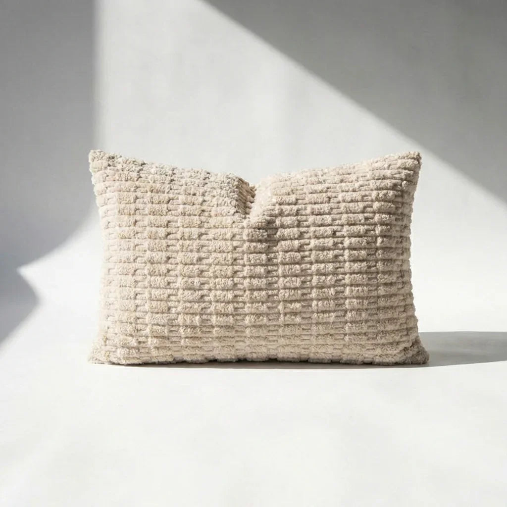 Beige corduroy lumbar pillow cover with wide-wale ribbed pattern on white background