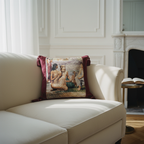 Classical figurative tapestry pillow cover in burgundy velvet on a white sofa in an elegant living room
