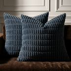 Set of 2 navy blue corduroy throw pillow covers styled on brown velvet sofa in classic living room setting
