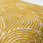 Close-up of a textured yellow surface with wavy patterns