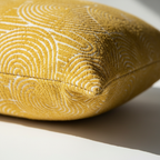 Close-up of a yellow textured object on a light background