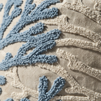 Close-up of raised looped punch needle coral branch texture in dusty blue yarn on cotton-linen blend fabric