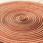 Macro detail of concentric braided jute weave on round placemat – Larissa Home Decor