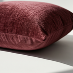 Side view of burgundy chenille pillow cover with hidden zipper closure detail