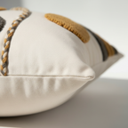 Side view of tufted abstract boho pillow cover showing hidden zipper closure and cotton canvas backing
