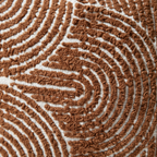 Close-up texture detail of tufted burnt orange chenille pillow cover showing looped swirl pattern on cotton base