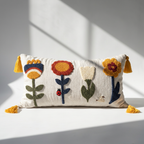 Handcrafted punch needle floral lumbar pillow cover with mustard tassels on white surface — cotton canvas, 12x20 in