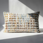 Chenille tufted lumbar throw pillow cover in cream multicolor boho palette displayed on white surface