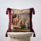 Burgundy velvet and Renaissance tapestry throw pillow cover with corner tassels on stone pedestal